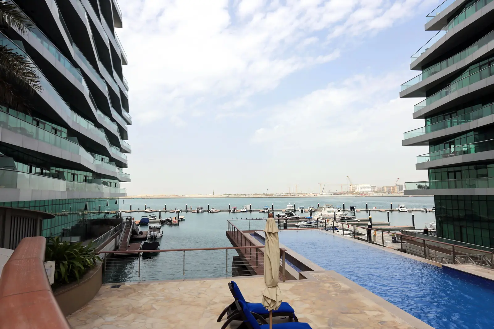 Al Jawzaa Tower exterior view highlighting its waterfront community location in Al Raha Beach.